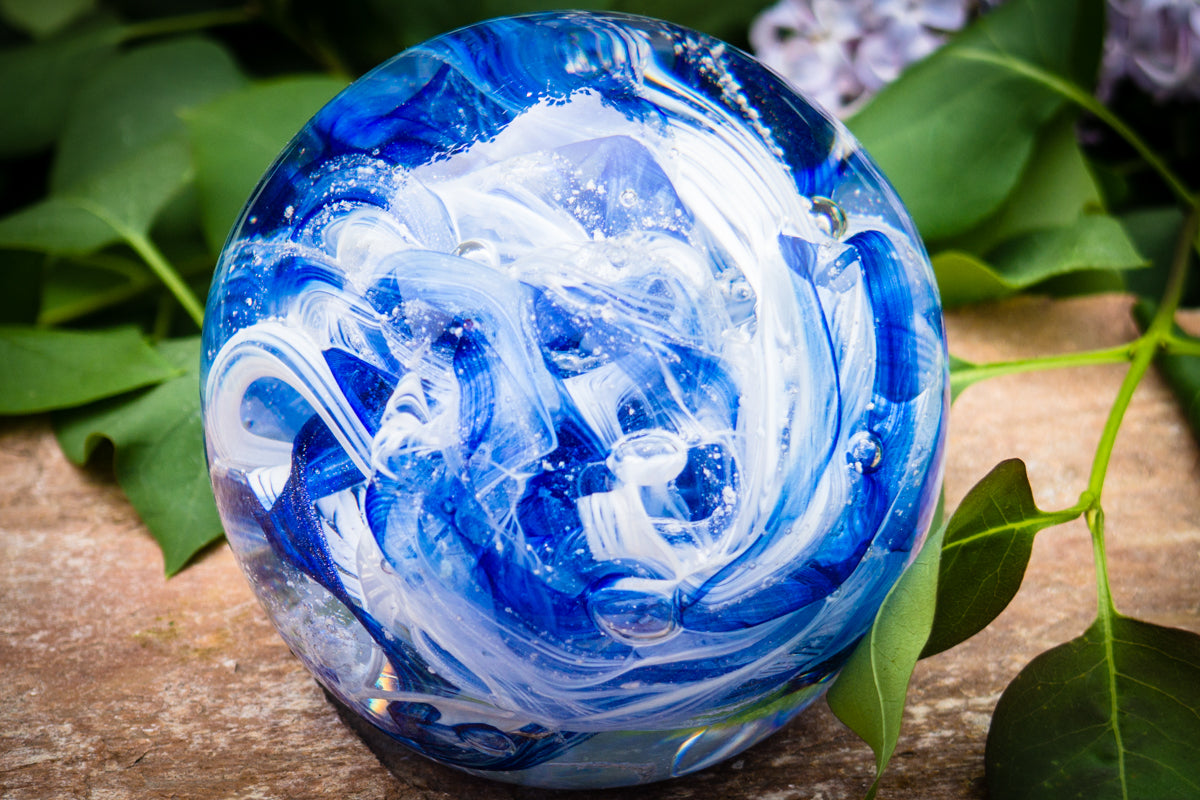 Ashes in glass orb for rememberance of people and pets
