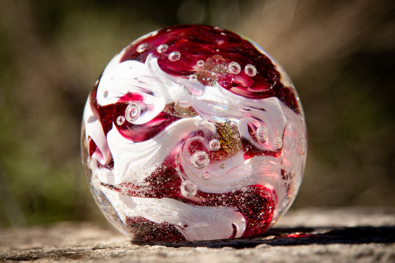 Glass orbs with cremation ash