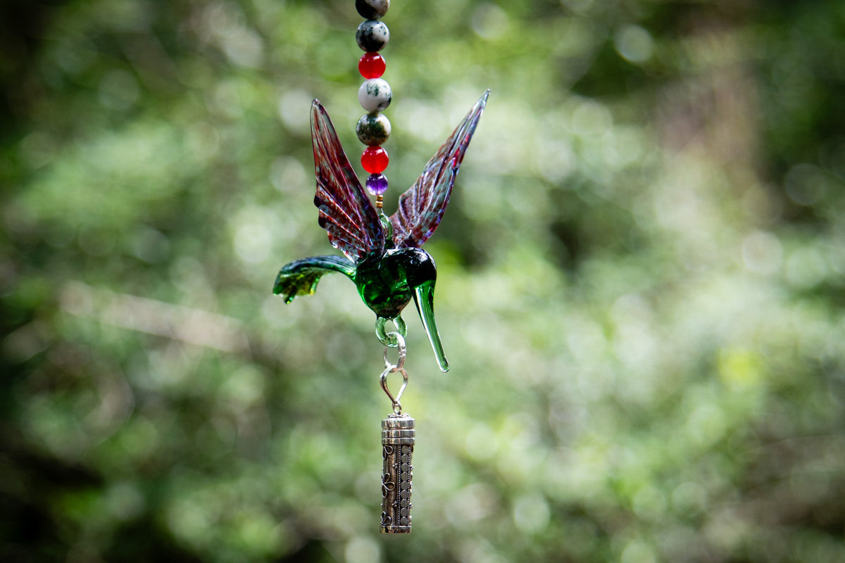 hummingbird with silver keepsake pendant