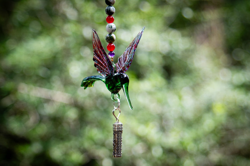 hummingbird with silver keepsake pendant