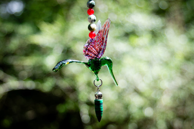 hummingbird with malachite pendant