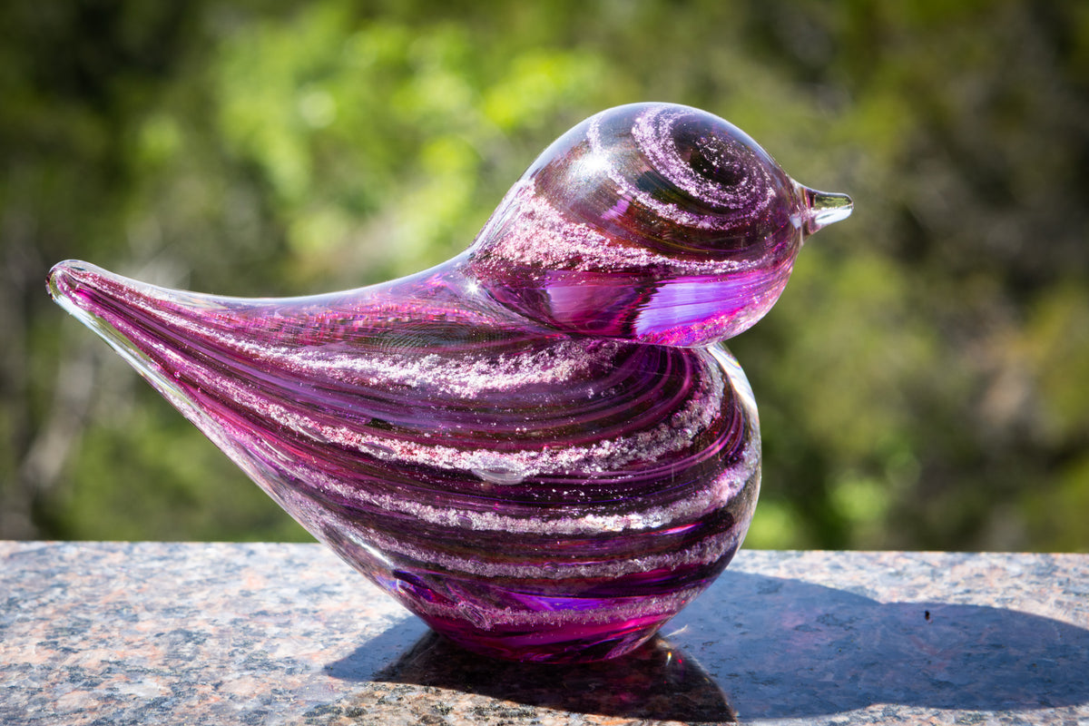 glass bird with cremation ash